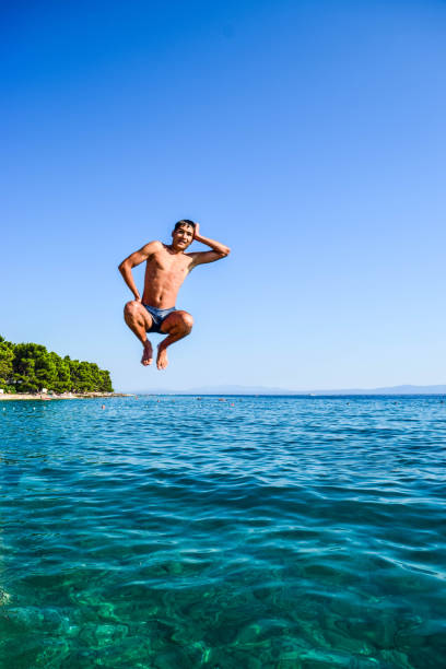 istock Jump into the sea. 1144528355