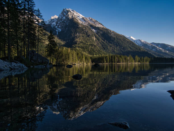 istock A mountain top is reflected in the clear water 1144530885