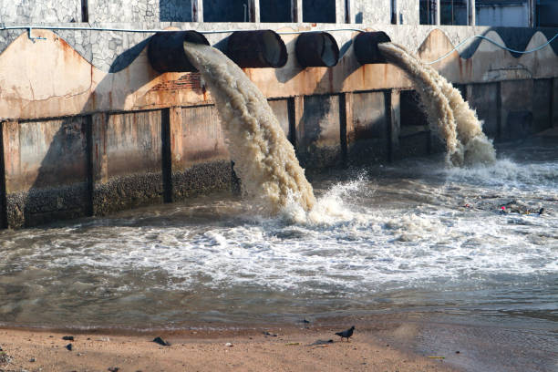 istock Waste water discharge pipe into canal and sea 1144532972