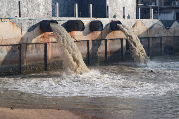 istock Waste water discharge pipe into canal and sea 1144533196