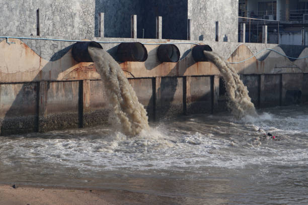 istock Waste water discharge pipe into canal and sea 1144533235