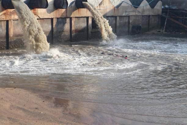 istock Waste water discharge pipe into canal and sea 1144533281