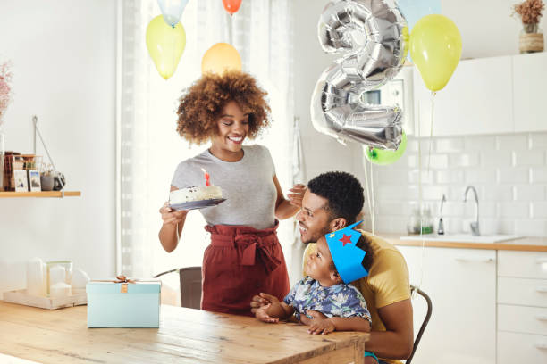 istock Parents celebrating son's birthday at home 1144534880