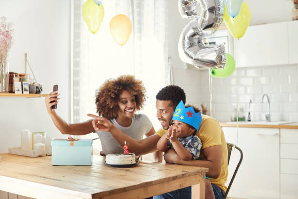 Family taking selfie while celebrating birthday