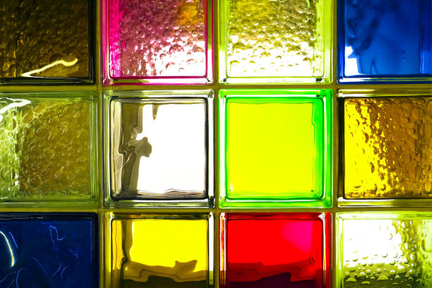 istock colored glass blocks. Colorful glass blocks panel for background pattern. 1144535282