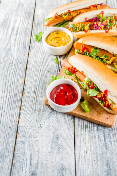 istock Homemade hot dogs with sauces 1144535648