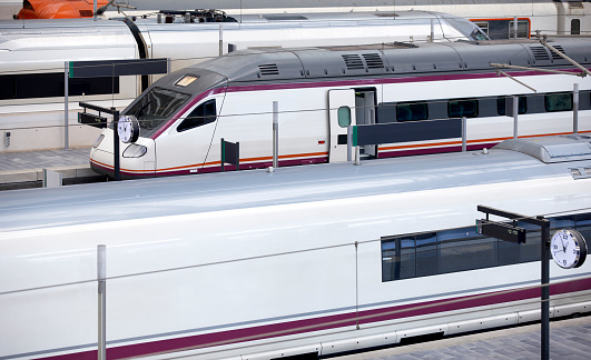 Passenger trains in a futuristic railroad station, Liege, Guillemins, Belgium.