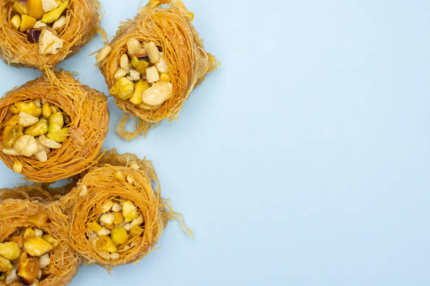 istock Lebanese baklava nest isolated on light blue 1144537197