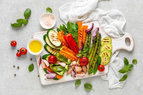 istock Grilled vegetables served on a wooden board, view from above 1144537377