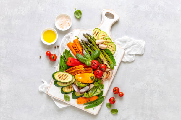 istock Grilled vegetables served on a wooden board, view from above 1144537455