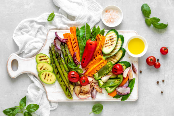 istock Grilled vegetables served on a wooden board, view from above 1144537463