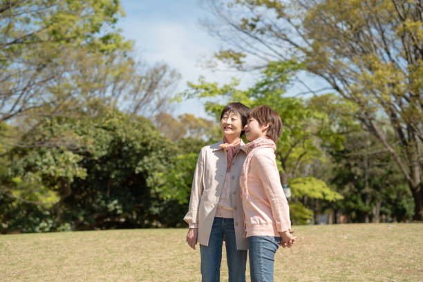 istock Senior mother and her daughter talking in park 1144537467
