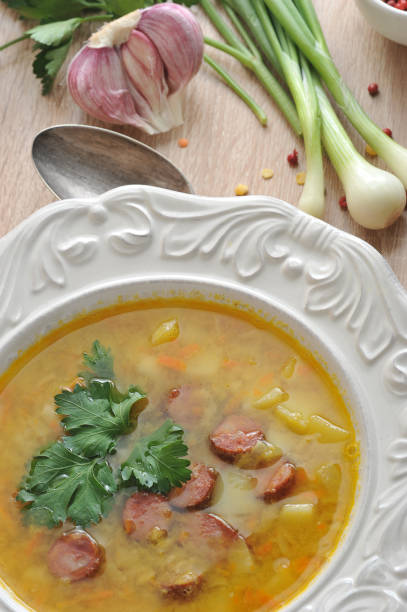 istock Pea soup with smoked meats and fresh parsley. 1144537621