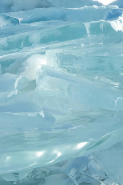 Photo of Background image of transparency blue ice pan in stacked layer.