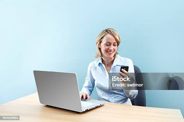 Office Worker Texting Stock Photo - Download Image Now - Adult, Adults Only, Blond Hair