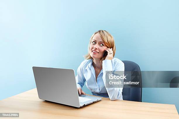 Office Worker Talking On Cell Phone Stock Photo - Download Image Now - Adult, Adults Only, Blond Hair