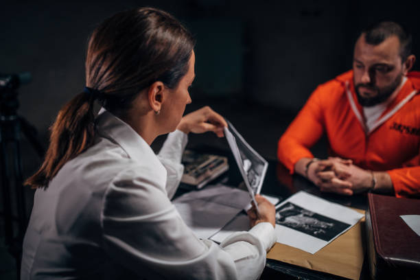 istock Woman detective interrogating a prisoner 1144543414