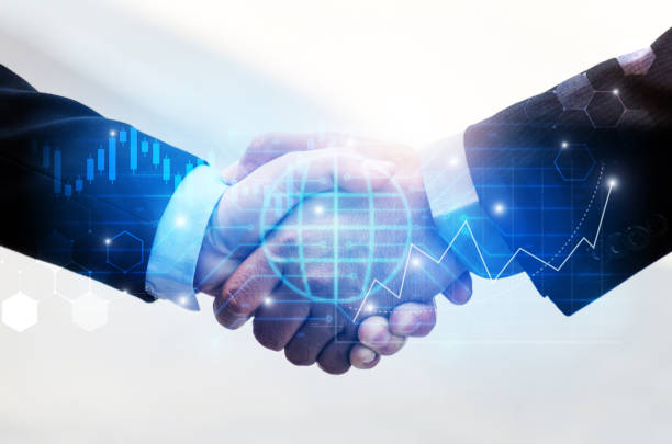 istock Partnership - business man handshake with effect global world network link connection and graph chart of stock market graphic diagram, digital technology, internet communication, teamwork concept 1144544441