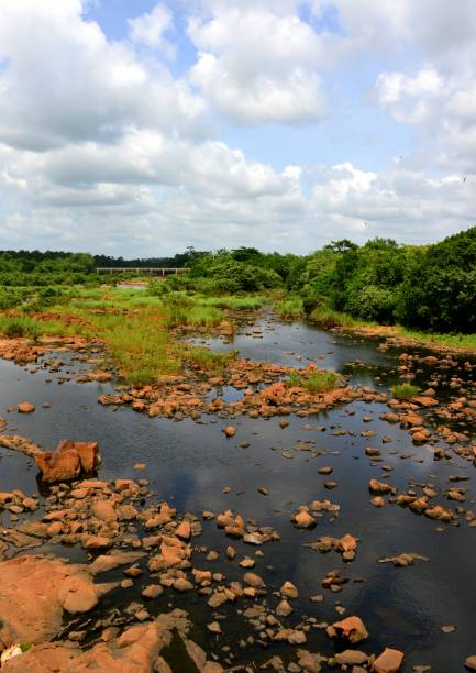 Osun River, Oyo State, Nigeria Osun River, Oyo State, Nigeria: view downstream of the river Osun from the bridge on the A122 expressway - Osun River is sacred in Yoruba Religion oyo state stock pictures, royalty-free photos & images