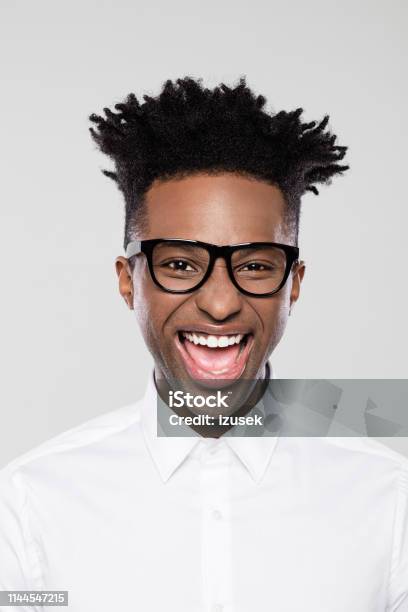 Excited Afro American Young Businessman Stock Photo - Download Image Now - Men, Afro Hairstyle, Businessman