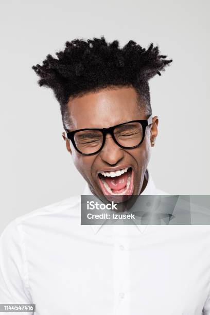 Funny Young African Businessman Looking Excited Stock Photo - Download Image Now - 20-29 Years, Adult, Adults Only
