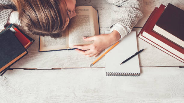istock student preparing exams sleeping tired exhaustion 1144547973