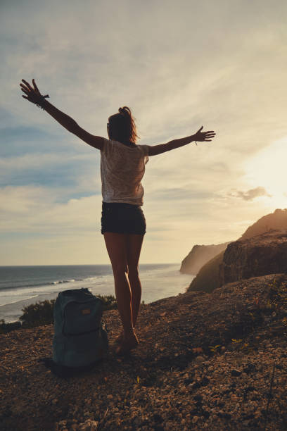 istock Tourist girl with backpack enjoying the view. 1144548860