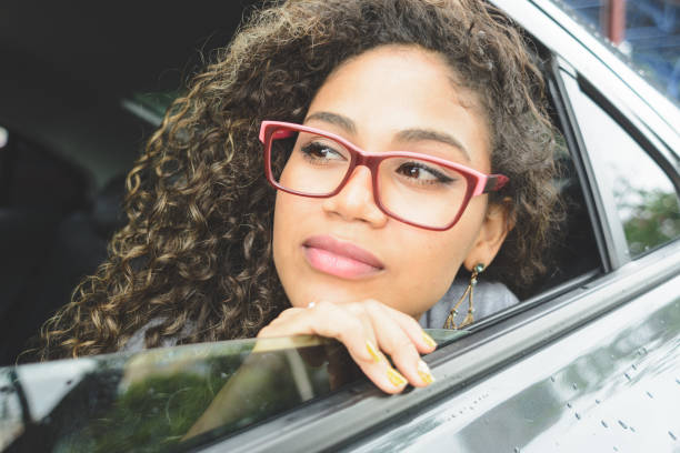 istock Woman looking out from the car window 1144550018