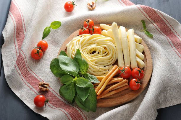 istock Figured Chechil cheese on a wooden platter. 1144551771