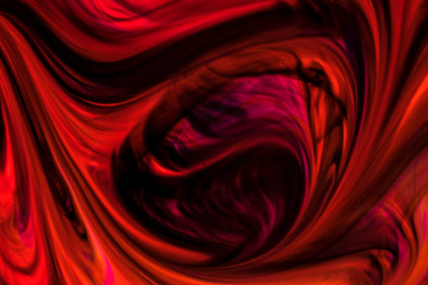 istock Background of red, orange, black ink waves 1144554185