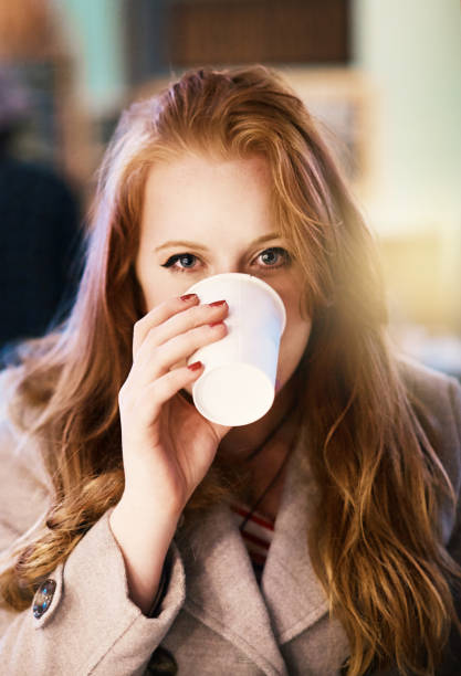 istock Young girl drinks coffee 1144557485