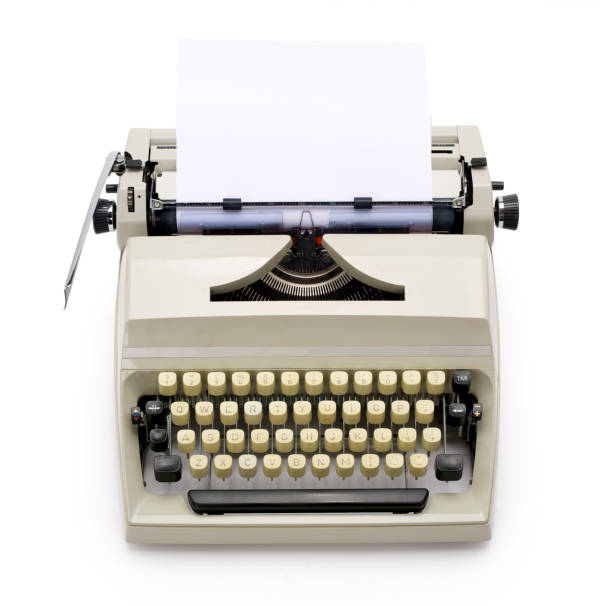 istock Typewriter from the 70s with blank paper on white background. 1144559182