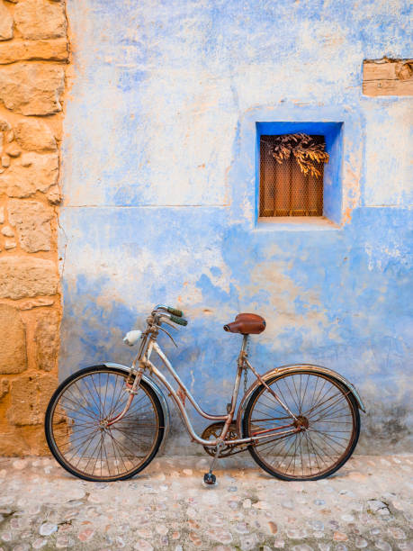 istock Old classic bicycle parked on a village street. 1144560684