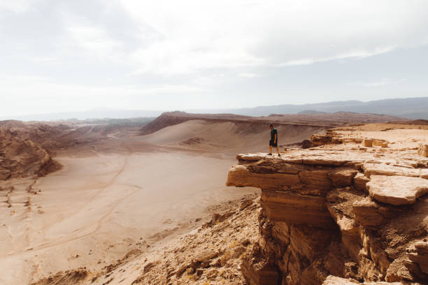 istock Man meets sunset at beautiful canyon in Atacama desert 1144575683