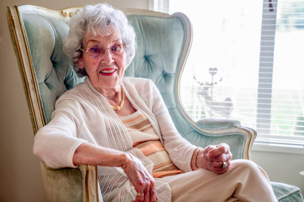 100-Year Old Woman Having a Cheerful Conversation in Her Home 100-Year Old Woman Having a Cheerful Conversation in Her Home over 100 photos stock pictures, royalty-free photos & images