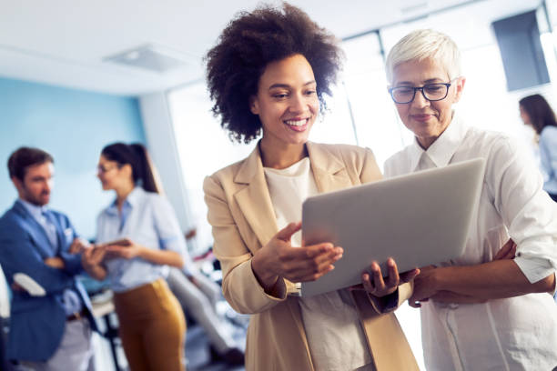 istock Successful group of business people at work in office 1144575943