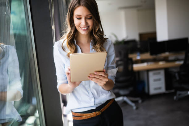 istock Successful business woman looking confident and smiling 1144576008