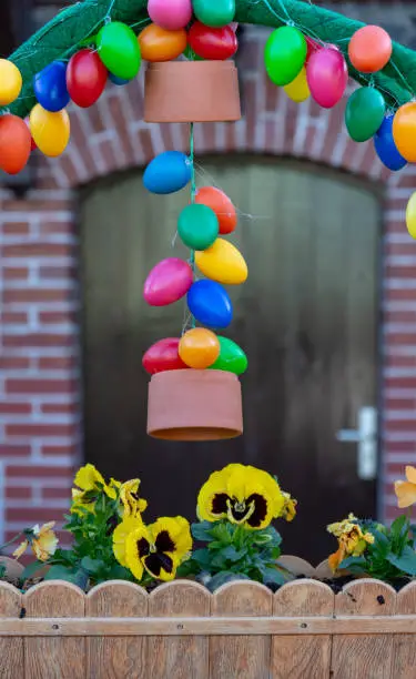 easter decoration in front of a house with a flower box