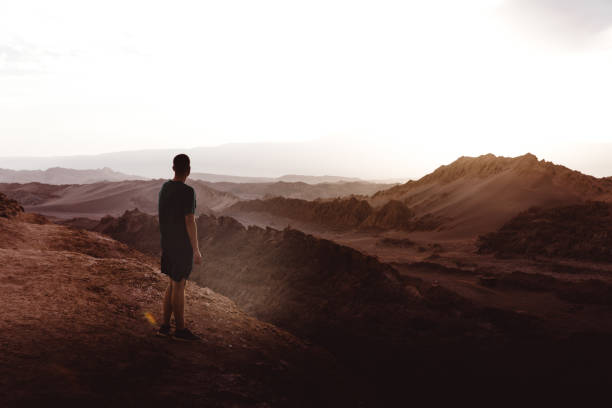 istock Man meets sunset at Moon Valley in Chile 1144579237