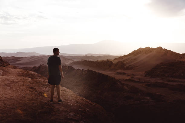 istock Man meets sunset at Moon Valley in Chile 1144579239