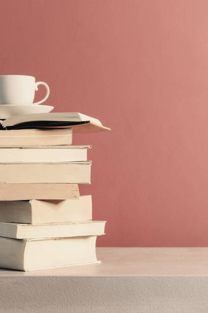 istock Cup of coffee over a stack of closed books 1144579505