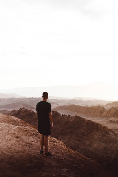 istock Man meets sunset at Moon Valley in Chile 1144580436