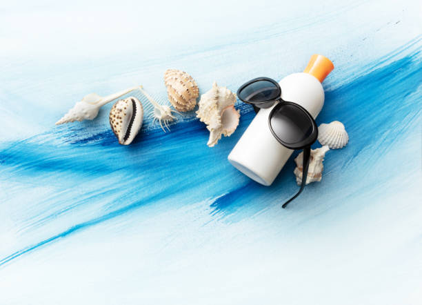 Summer: Suntan Lotion, Sunglasses and Shells Still Life