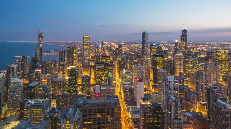 4K Time-Lapse : Aerial view of Chicago skyline Cityscape Day to Night at dusk USA