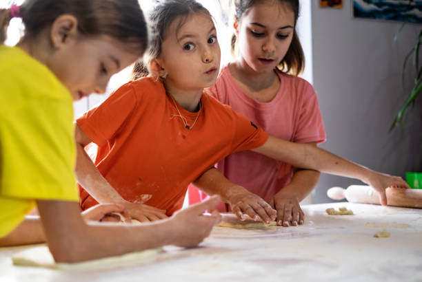 istock Girls love to bake bread 1144582386