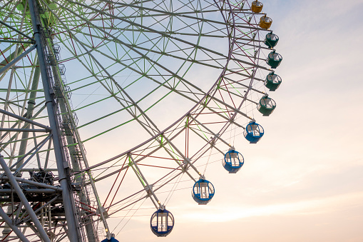 Ferry wheel on sunset sky