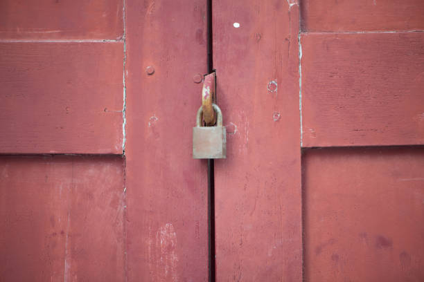 Lock on old wooden door show safety concept