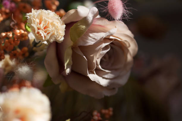 istock Artificial flower arrangement. Rose, carnation, berries. 1144583047