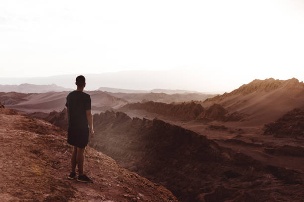 istock Man meets sunset at Moon Valley in Chile 1144583216