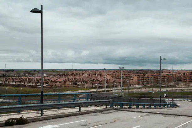 City in Spain with empty road in the foreground and the city in the background